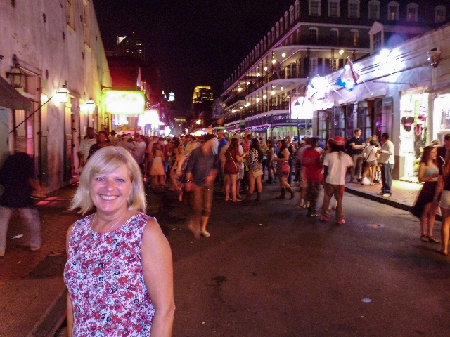 A mix between a smile and a grimace. Friday night on bourbon St, New Orleans